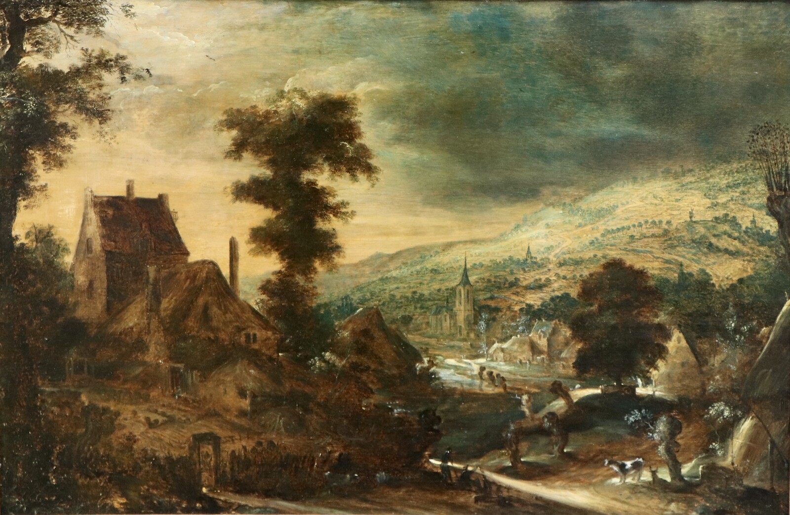 A hilly landscape with a farmhouse at left