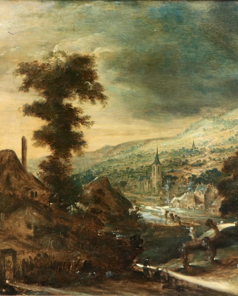 A hilly landscape with a farmhouse at left