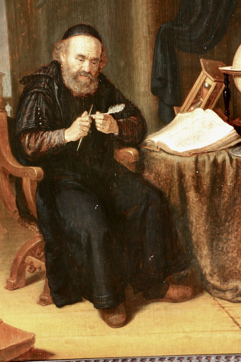 A scholar sharpening his quill in his study